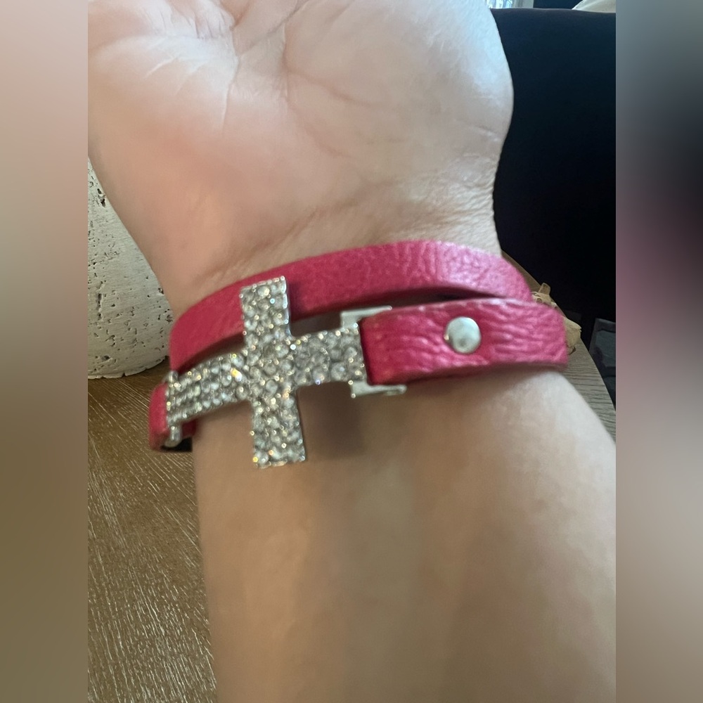Red/Pinkish Faux Leather Wrap Bracelet Featuring A Rhinestone Embellished Cross